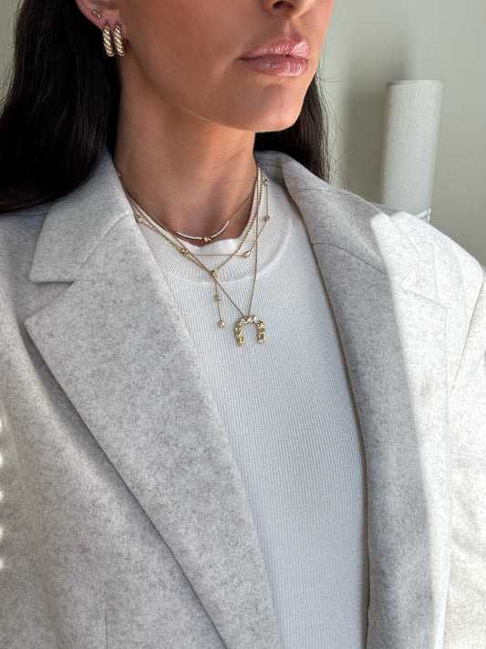 14 karat gold vintage hoops on model by BlaireBe Jewelry