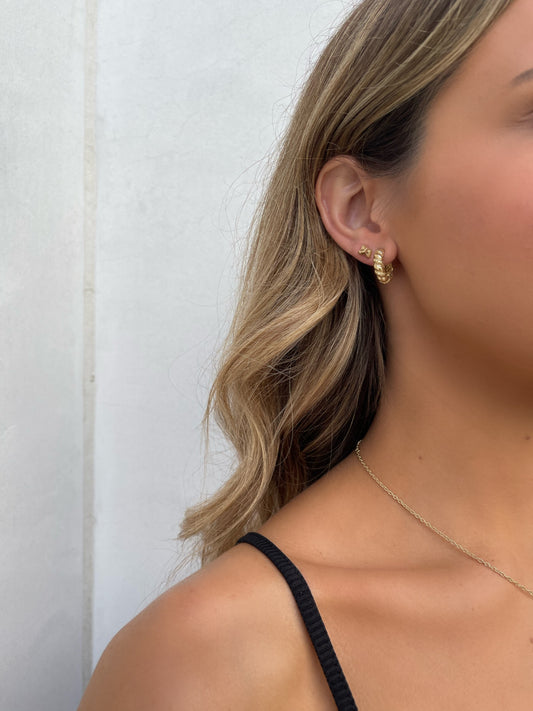 14 karat gold nugget stud earrings on model by BlaireBe Jewelry