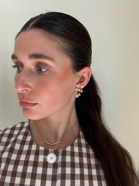 Side view of 14 karat gold lab-grown diamond square earrings by BlaireBe Jewelry

