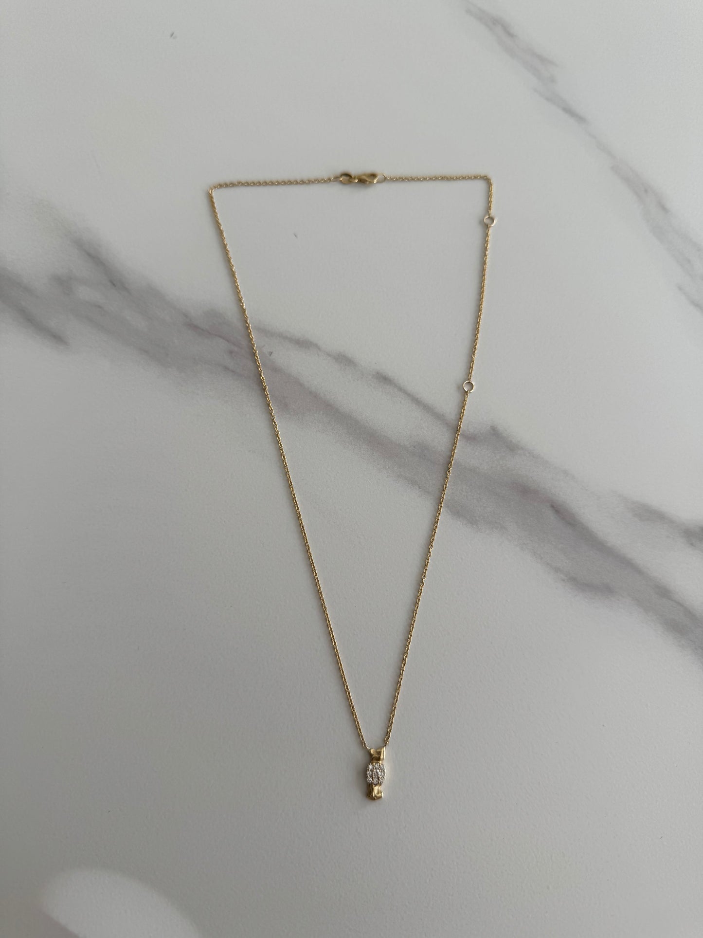 Detail view 14 karat gold lab-grown diamond bow tie pendant necklace by BlaireBe Jewelry