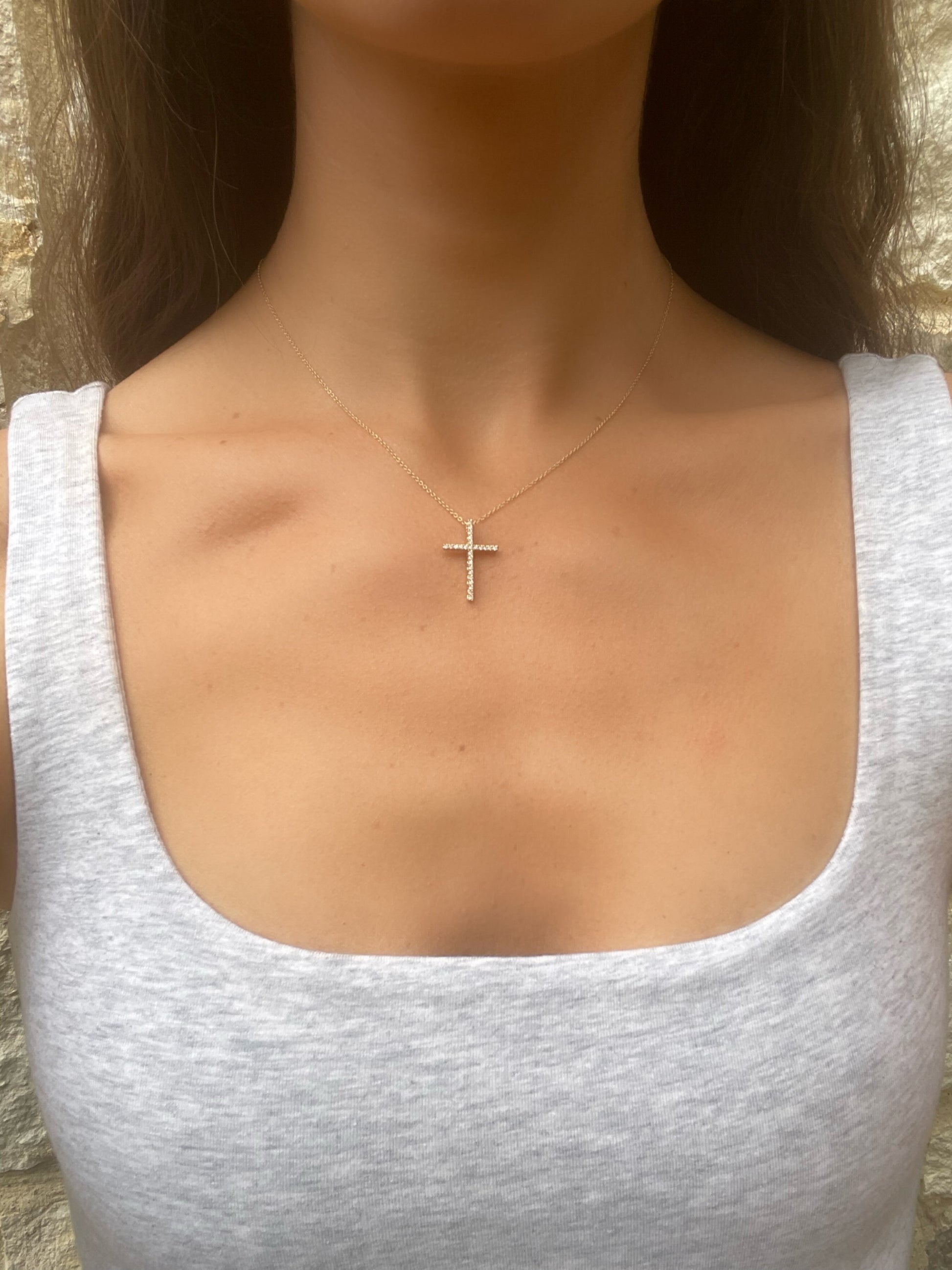 Close up 14 karat gold lab-grown diamond cross necklace by BlaireBe Jewelry