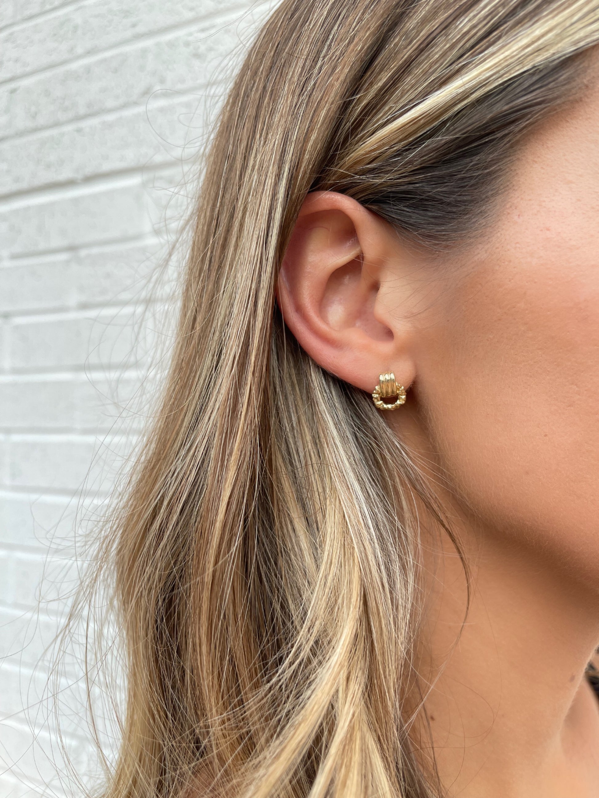14 karat gold door knocker earrings on model by BlaireBe Jewelry
