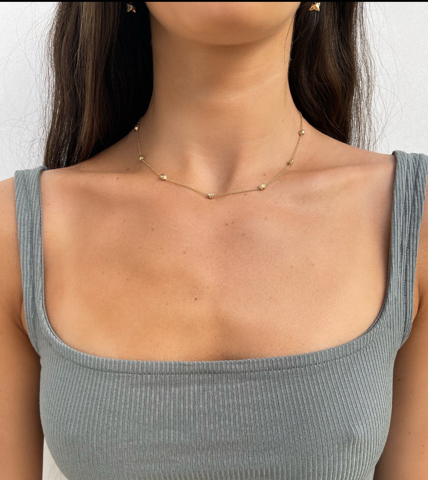 14 karat gold delicate nugget necklace on model by BlaireBe Jewelry